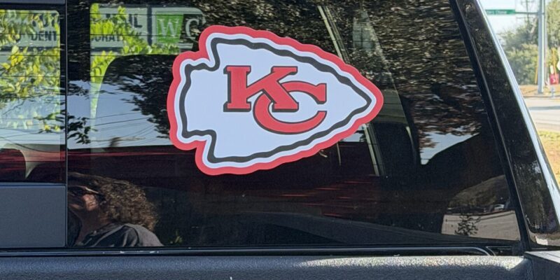 Custom car window decal and vinyl sports logo printed and installed by our local print shop near me in Austin.