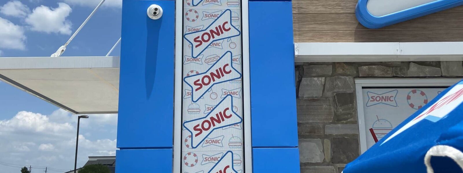 Professionally installed perforated window vinyl and one-way vision restaurant graphics by our local print shop near me in Austin.