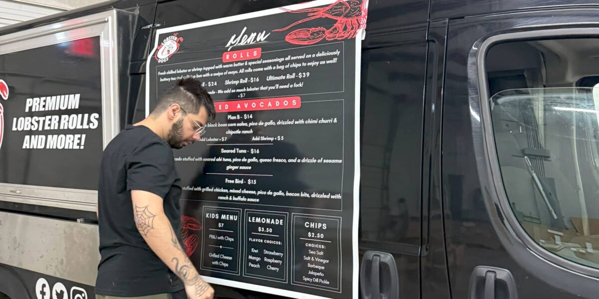 Custom food truck menu graphic and vinyl vehicle signage installed by our local print shop near me in Austin.