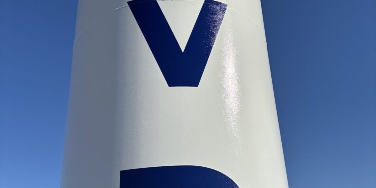 Large industrial stenciled decal and custom vinyl lettering installed by our local print shop near me in Austin.