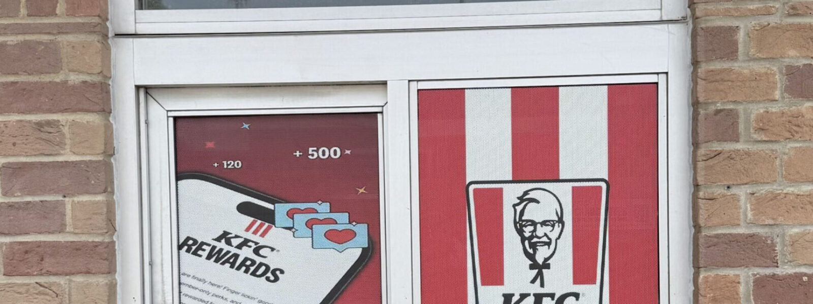 Custom perforated window film and one-way vision storefront graphics installed by our local print shop near me in Austin.